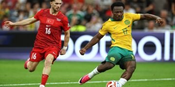 Australia's Nestory Irankunda (17) scores the first goal of the match in front of Turkey's Ismail Yuksek (16) during the World Cup Group D soccer match between Australia and Turkey in Vancouver, Canada, Saturday, June 13, 2026. (AP Photo/Kaleb Tatum)